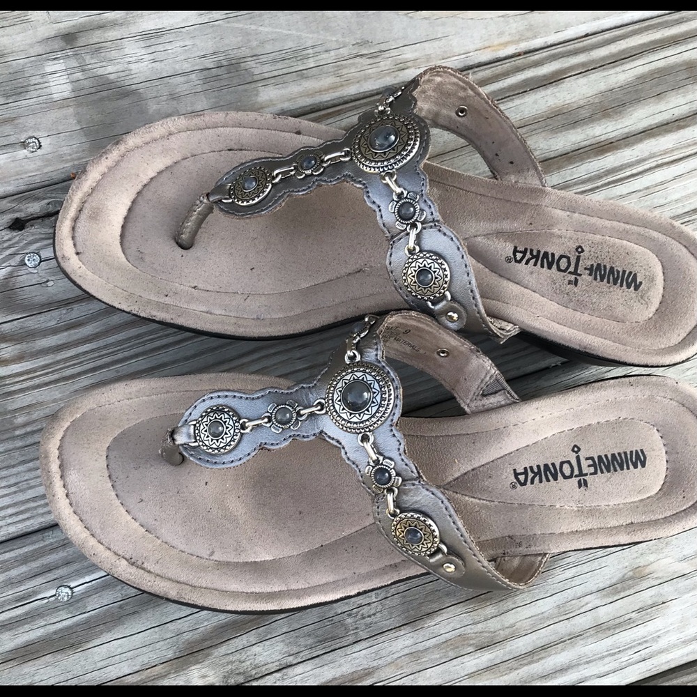 Minnetonka slides . Silver metallic. Size 8.5